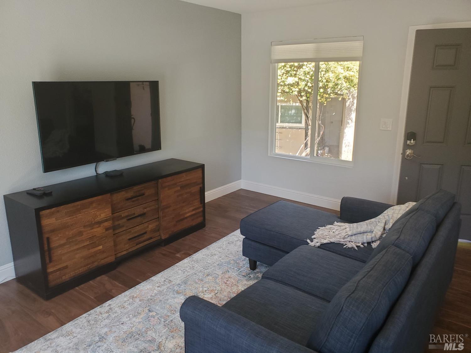 931 Champion Lane Deer Park, CA 94576 - Photo 1 of 10 a living room with furniture rug and window