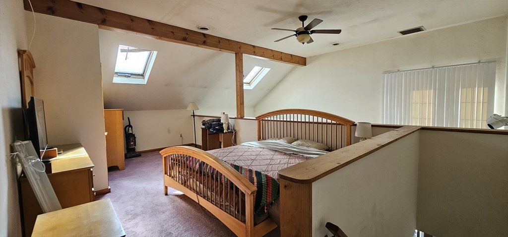 191 City Depot Road, Unit A Charlton, MA 01507 - Photo 2 of 12 a bedroom with furniture and a window