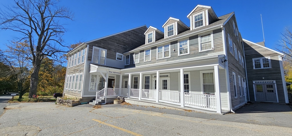 191 City Depot Road, Unit A Charlton, MA 01507 - Photo 4 of 12 a front view of a building with a parking space