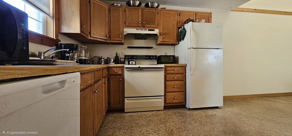 191 City Depot Road, Unit A Charlton, MA 01507 - Photo 5 of 12 a kitchen with appliances a sink and cabinets