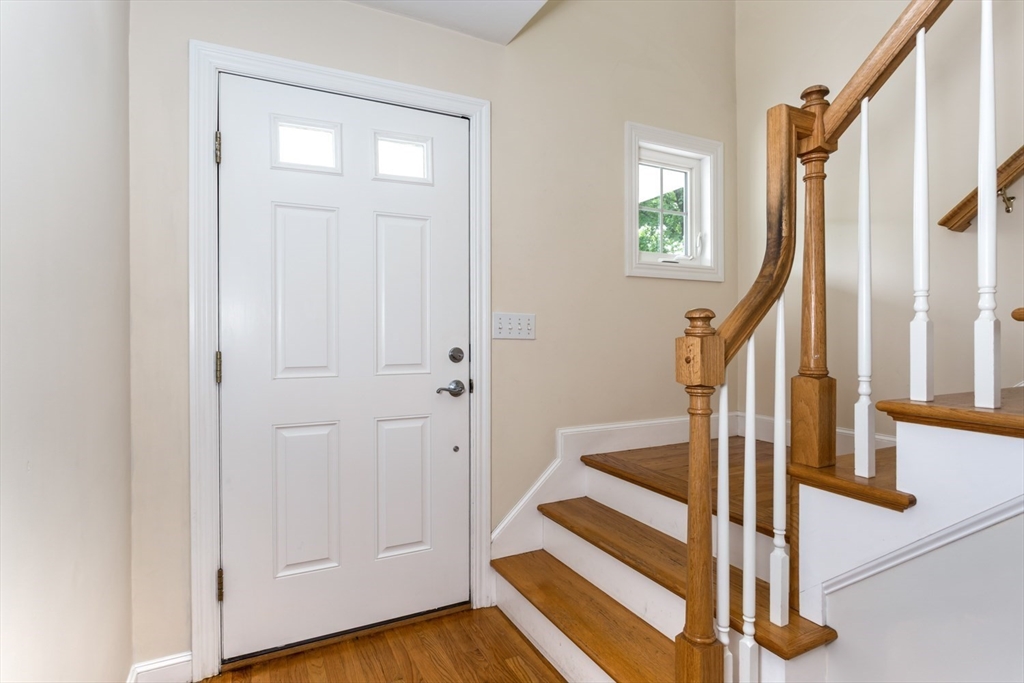 49 Beaver Street, Unit 49 Franklin, MA 02038 - Photo 16 of 46 a view of entryway with wooden floor and front door