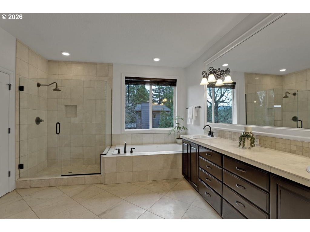 3356 Northwest 153rd Terrace Portland, OR 97229 - Photo 13 of 24 a spacious bathroom with a bathtub sink and mirror