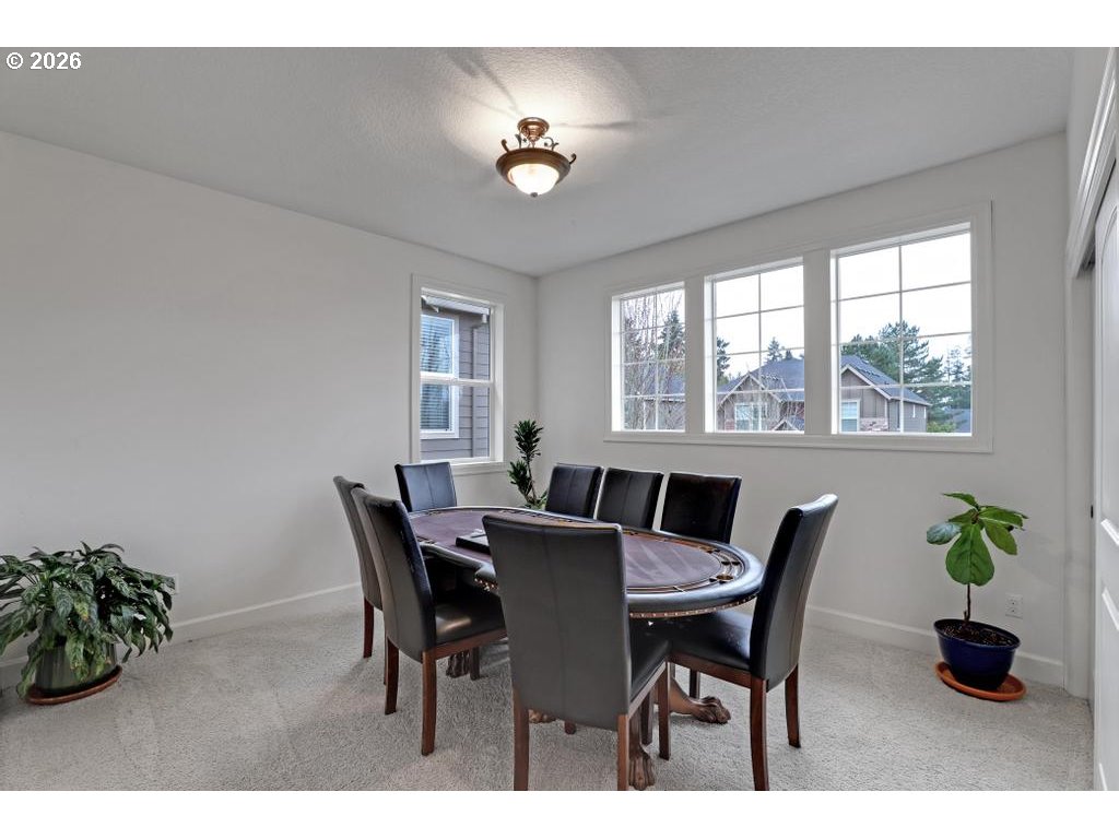 3356 Northwest 153rd Terrace Portland, OR 97229 - Photo 17 of 24 a view of a dining room with furniture and a potted plant