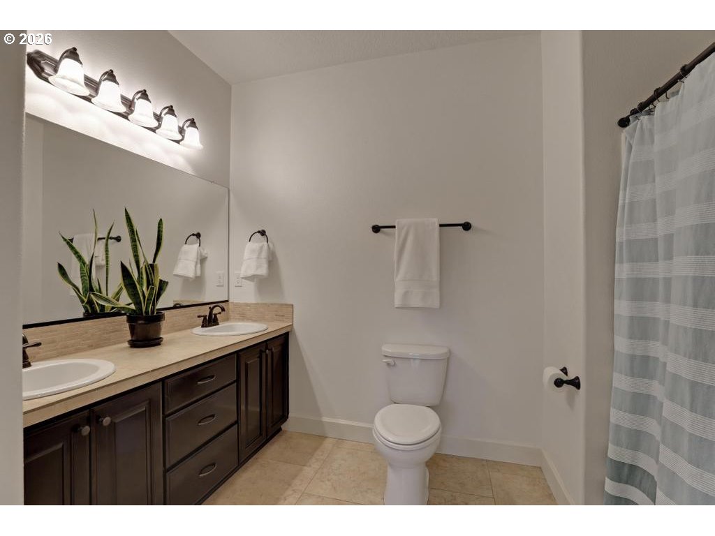 3356 Northwest 153rd Terrace Portland, OR 97229 - Photo 18 of 24 a bathroom with a sink vanity granite and toilet