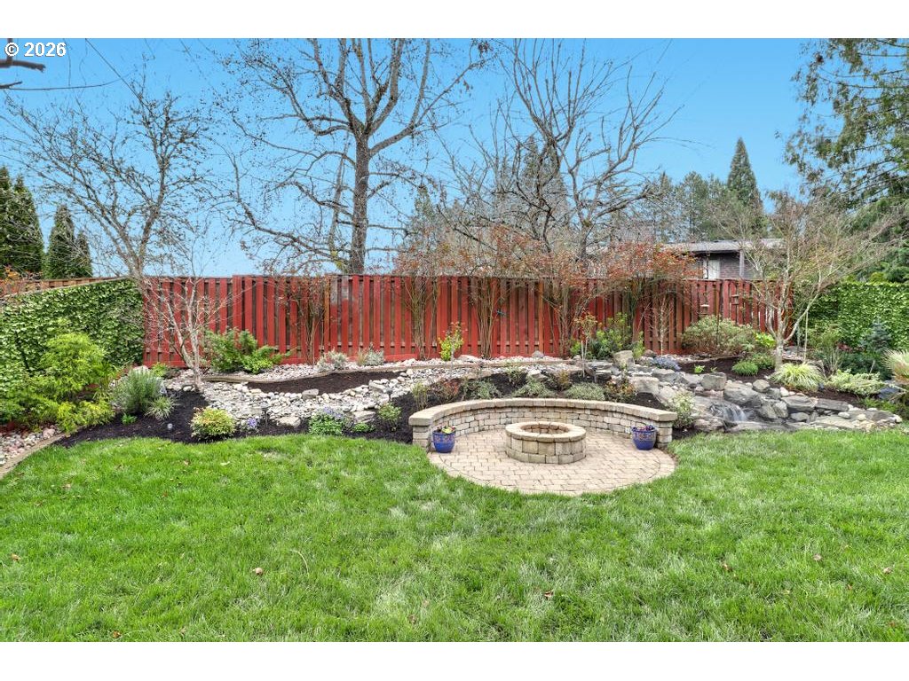3356 Northwest 153rd Terrace Portland, OR 97229 - Photo 20 of 24 a view of a backyard with couches with wooden fence and plants