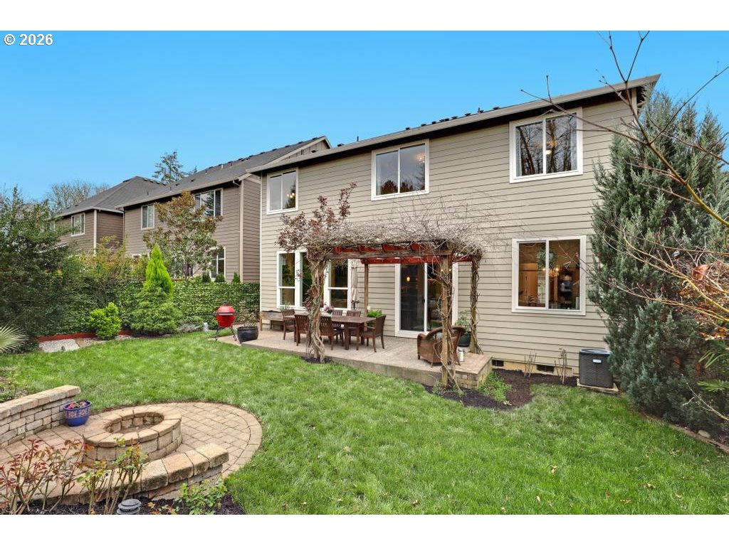 3356 Northwest 153rd Terrace Portland, OR 97229 - Photo 23 of 24 a view of backyard of house with outdoor seating and green space