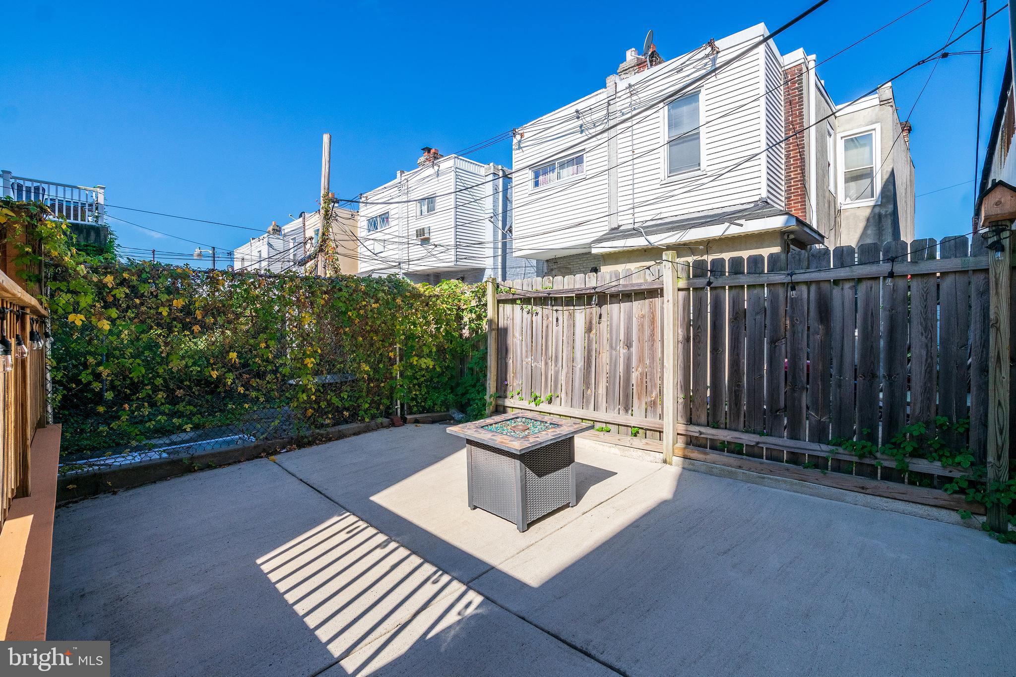 3462 Almond Street Philadelphia, PA 19134 - Photo 17 of 32 a view of a patio with a table and chairs and potted plants