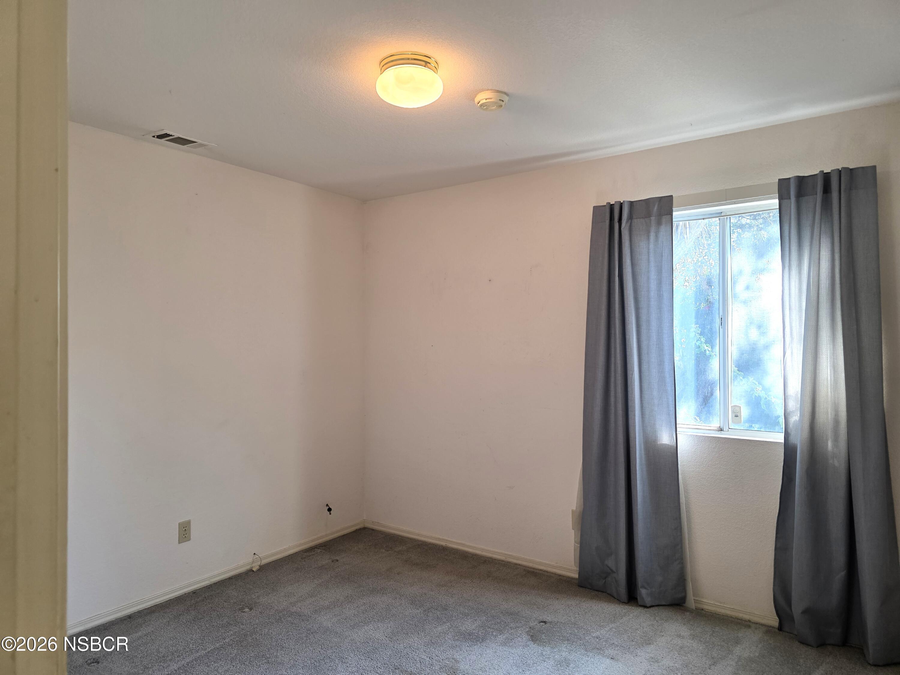 1112 Rachel Drive Santa Maria, CA 93454 - Photo 11 of 23 a view of an empty room and a window