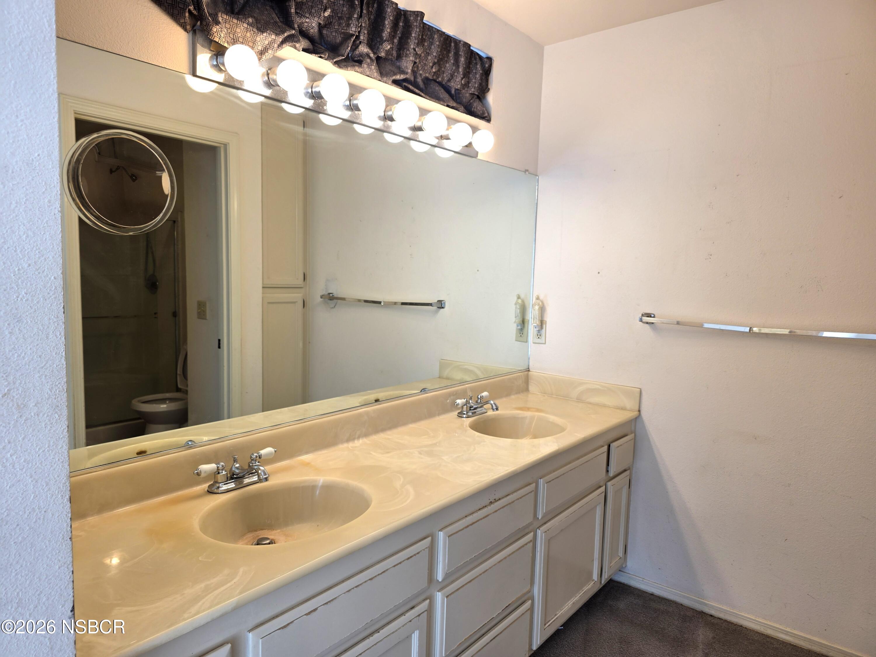1112 Rachel Drive Santa Maria, CA 93454 - Photo 14 of 23 a bathroom with a sink and a mirror