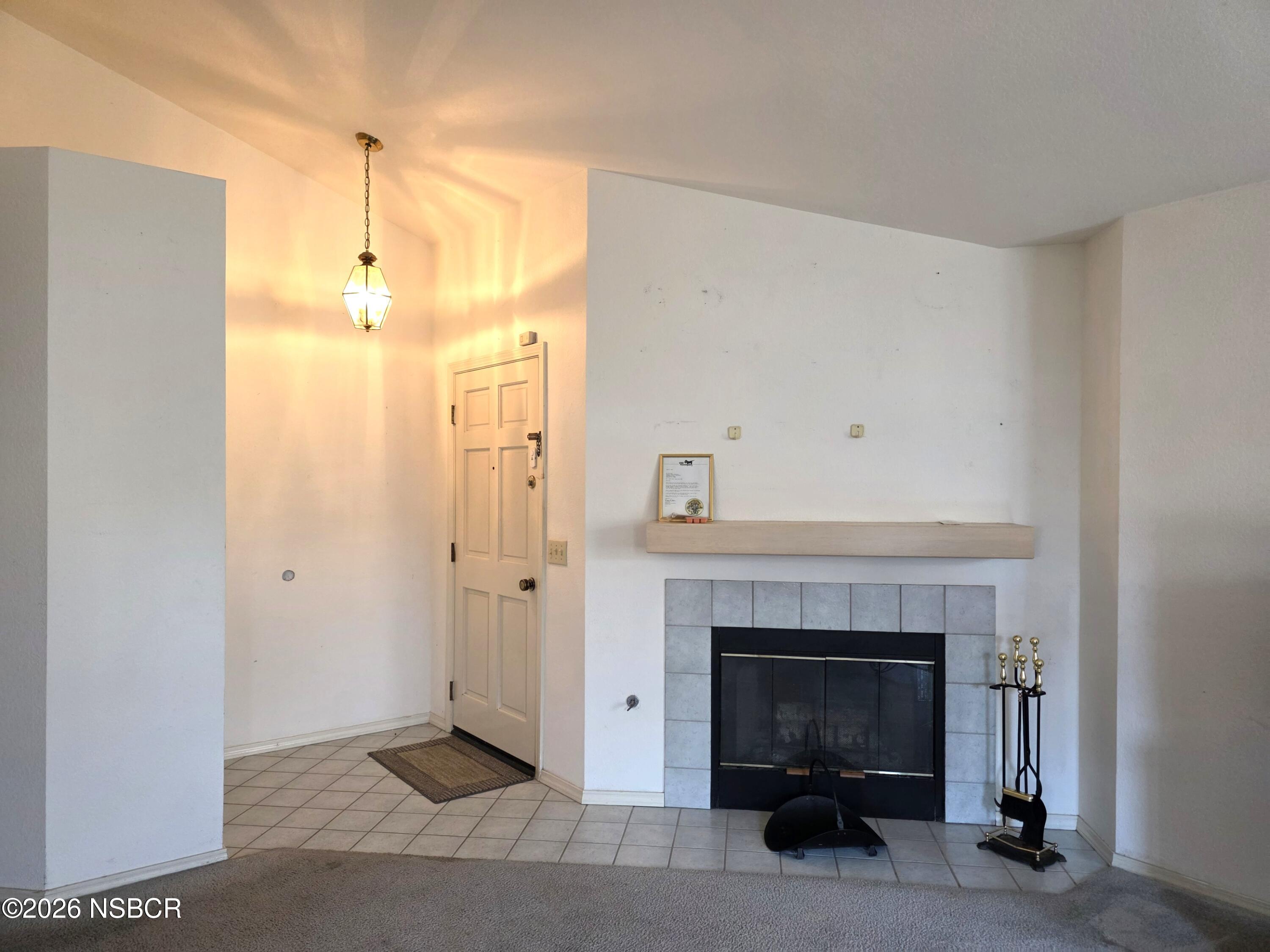 1112 Rachel Drive Santa Maria, CA 93454 - Photo 8 of 23 a view of a livingroom with a fireplace and cabinet