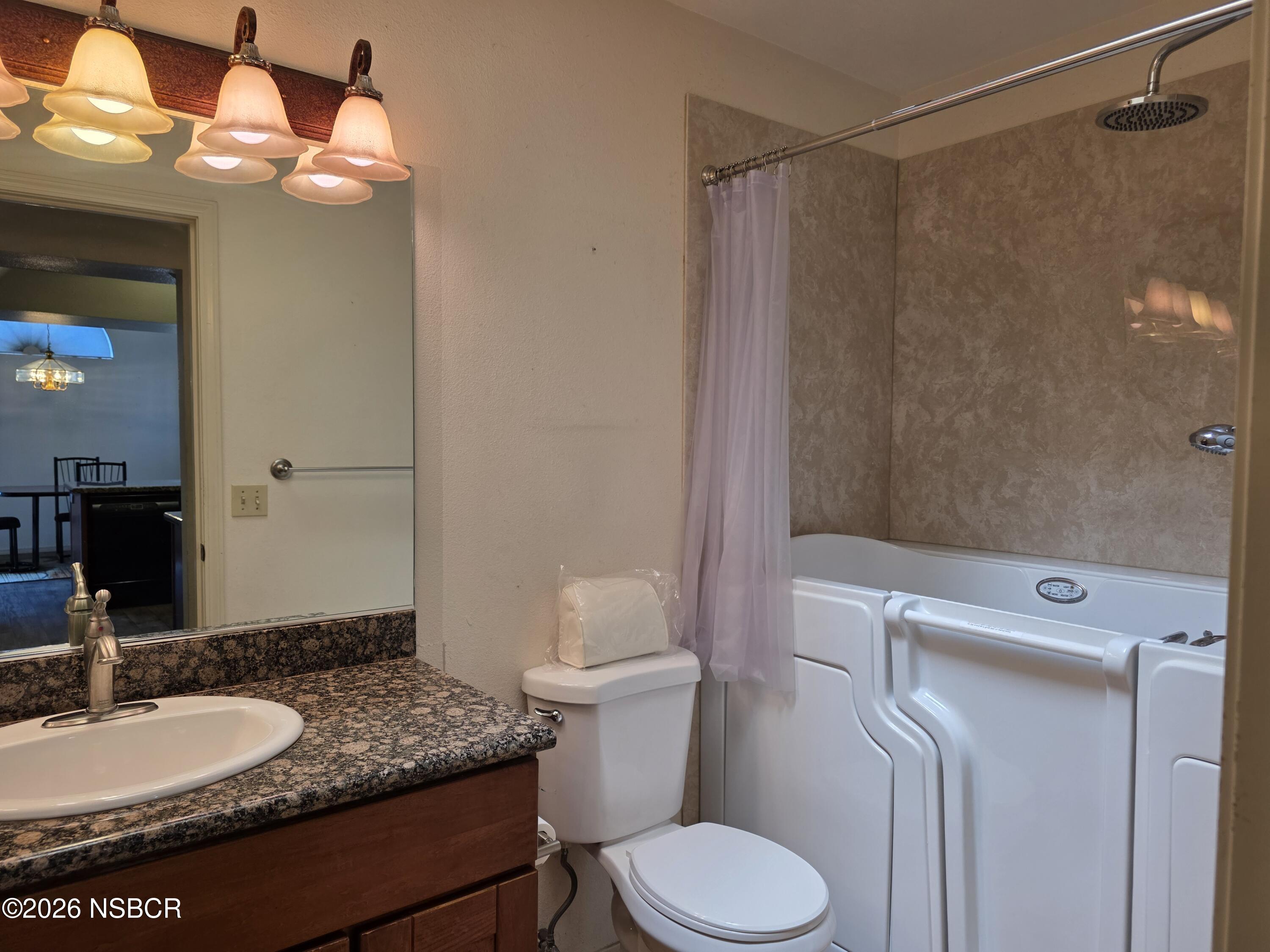 1112 Rachel Drive Santa Maria, CA 93454 - Photo 9 of 23 a bathroom with a granite countertop sink toilet and shower