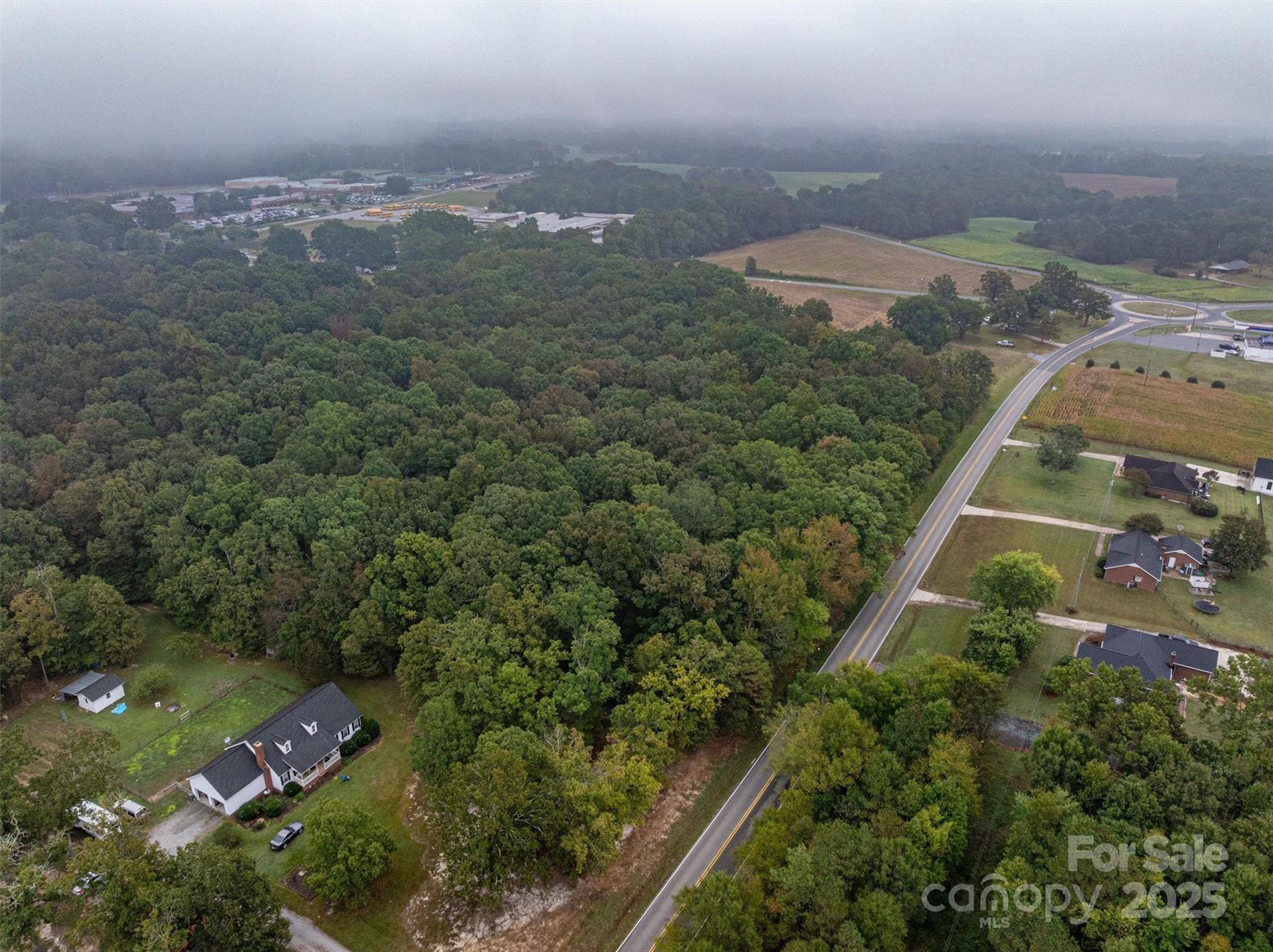 0 Sikes Mill Road Monroe, NC 28110 - Photo 7 of 20 an aerial view of a house with a yard