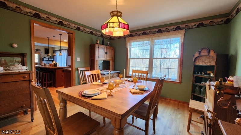 136 Route560 Layton, NJ 07851 - Photo 13 of 50 a view of a dining room with furniture window and wooden floor