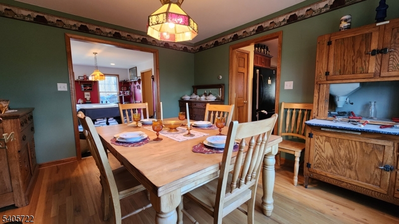 136 Route560 Layton, NJ 07851 - Photo 15 of 50 a view of a dining room with furniture and chandelier