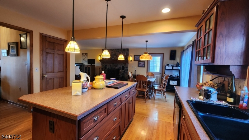 136 Route560 Layton, NJ 07851 - Photo 19 of 50 a kitchen with a table chairs and flat screen tv