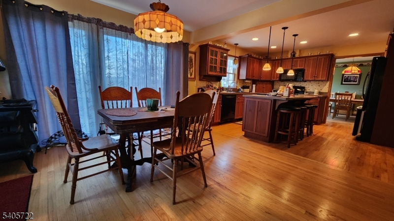 136 Route560 Layton, NJ 07851 - Photo 31 of 50 a view of a dining room with furniture and wooden floor