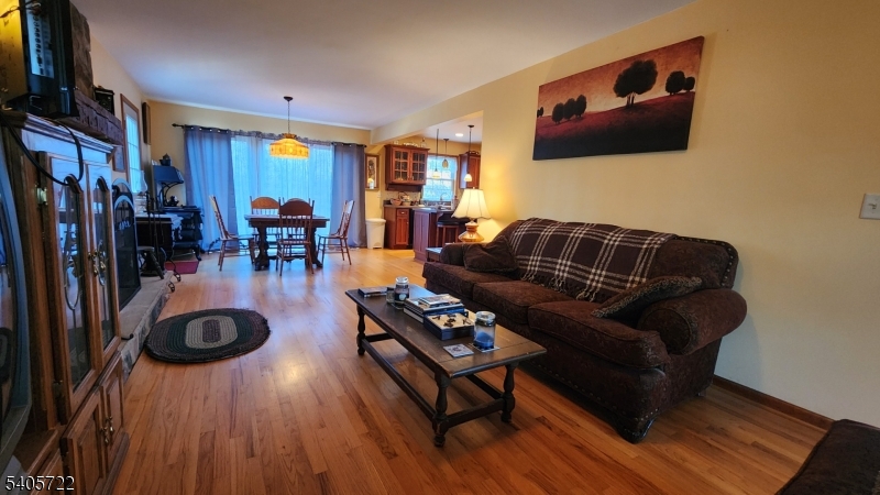 136 Route560 Layton, NJ 07851 - Photo 36 of 50 a living room with furniture a flat screen tv and a wooden floor