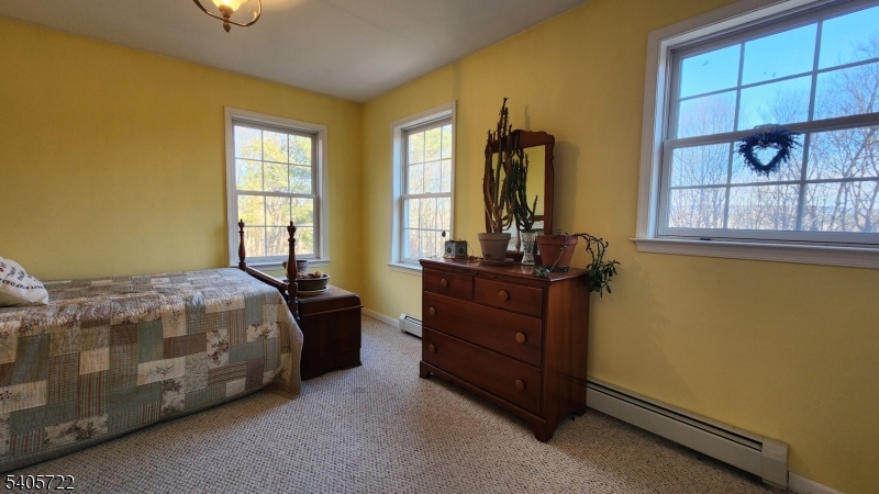 136 Route560 Layton, NJ 07851 - Photo 41 of 50 a bed sitting in a bedroom next to a window