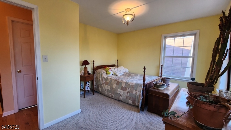 136 Route560 Layton, NJ 07851 - Photo 42 of 50 a bed room with a bed and a chair