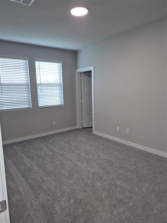 872 Sunflower Road Lavon, TX 75166 - Photo 7 of 12 an empty room with windows
