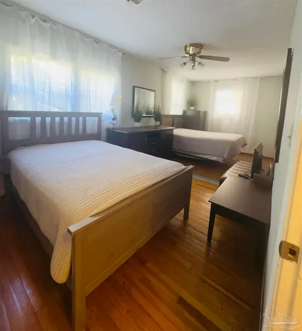 a spacious bedroom with a bed and window