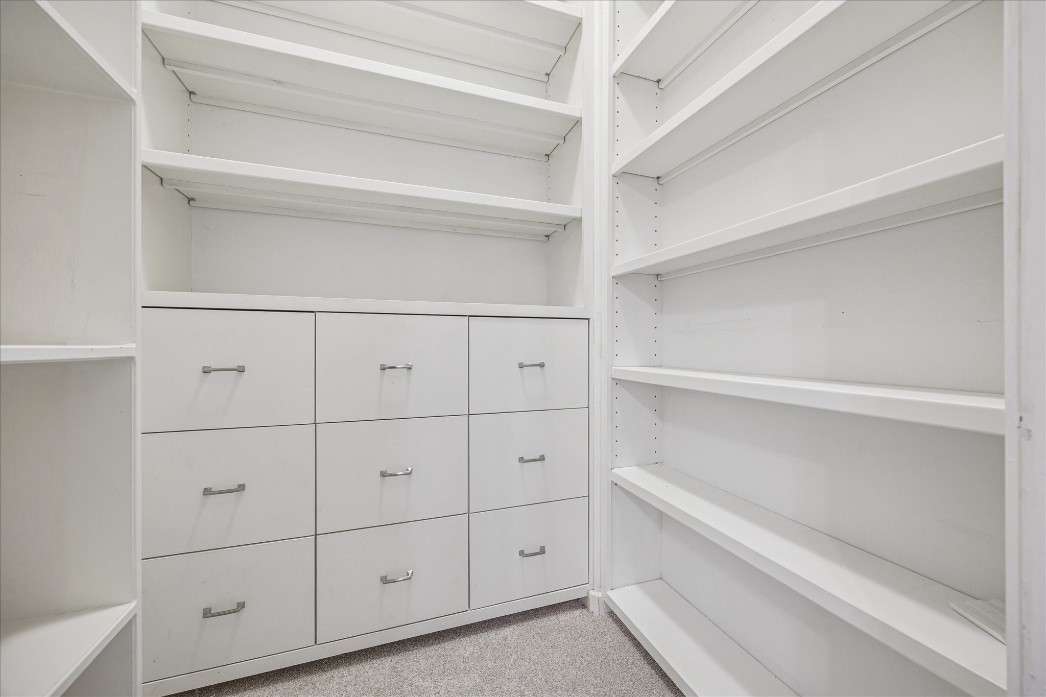 2422 Dorrington Street, Unit B Houston, TX 77030 - Photo 20 of 20 Downstairs bedroom closet has built-in file drawers and shelf space.