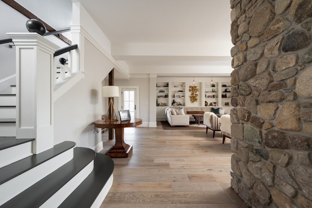 25 Mill Lane Hingham, MA 02043 - Photo 12 of 26 a living room with furniture and a fireplace