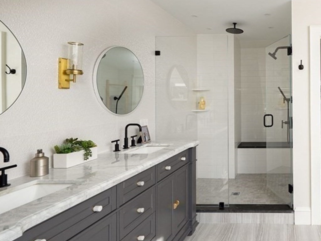 25 Mill Lane Hingham, MA 02043 - Photo 16 of 26 a bathroom with a granite countertop sink a mirror and shower