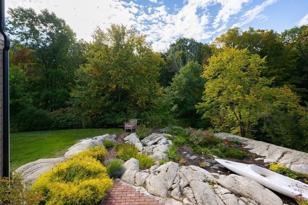 25 Mill Lane Hingham, MA 02043 - Photo 22 of 26 a view of a garden with an outdoor seating