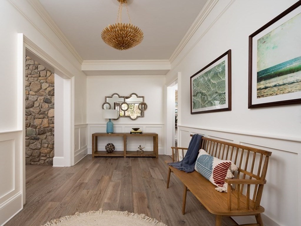 25 Mill Lane Hingham, MA 02043 - Photo 3 of 26 a living room with furniture and paintings on the wall