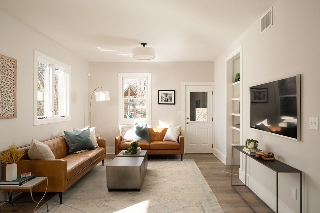 25 Mill Lane Hingham, MA 02043 - Photo 9 of 26 a living room with furniture and a flat screen tv