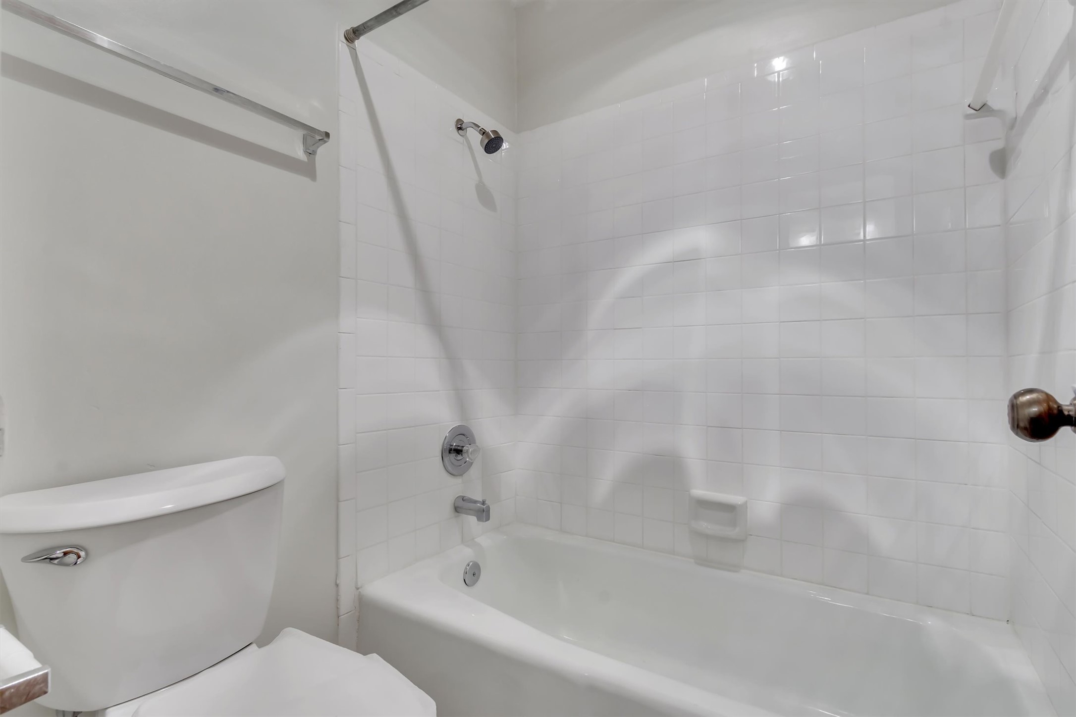 7802 Topawa Cove, Unit B Austin, TX 78729 - Photo 20 of 32 Newly remodeled ensuite bathroom with tub-shower combination, ready for daily rejuvenation.