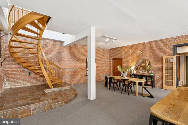 a dining room with furniture and chandelier