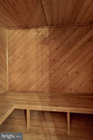 a view of a patio with couches table and chairs and potted plants