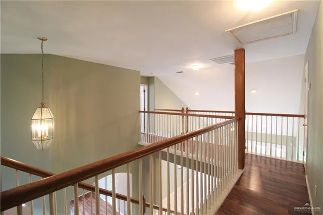 a view of staircase with railing and stairs
