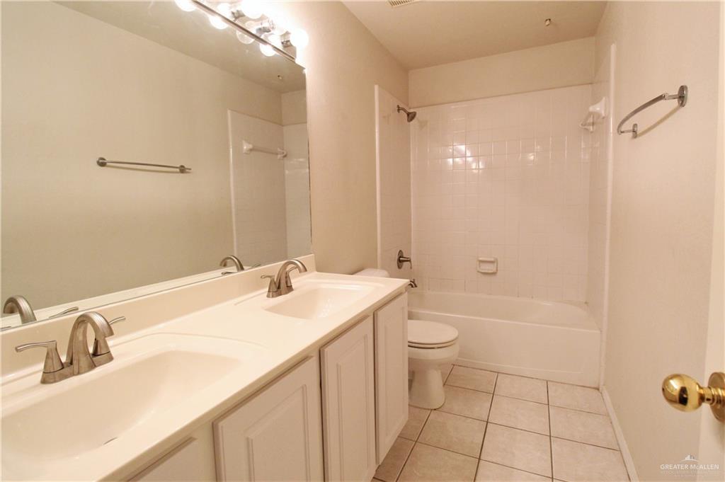 8202 North 22nd Lane McAllen, TX 78504 - Photo 18 of 25 a bathroom with a sink a toilet and shower
