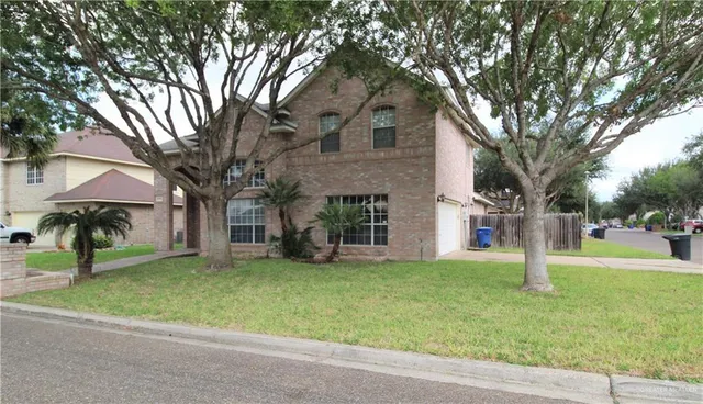 a view of a building with a yard