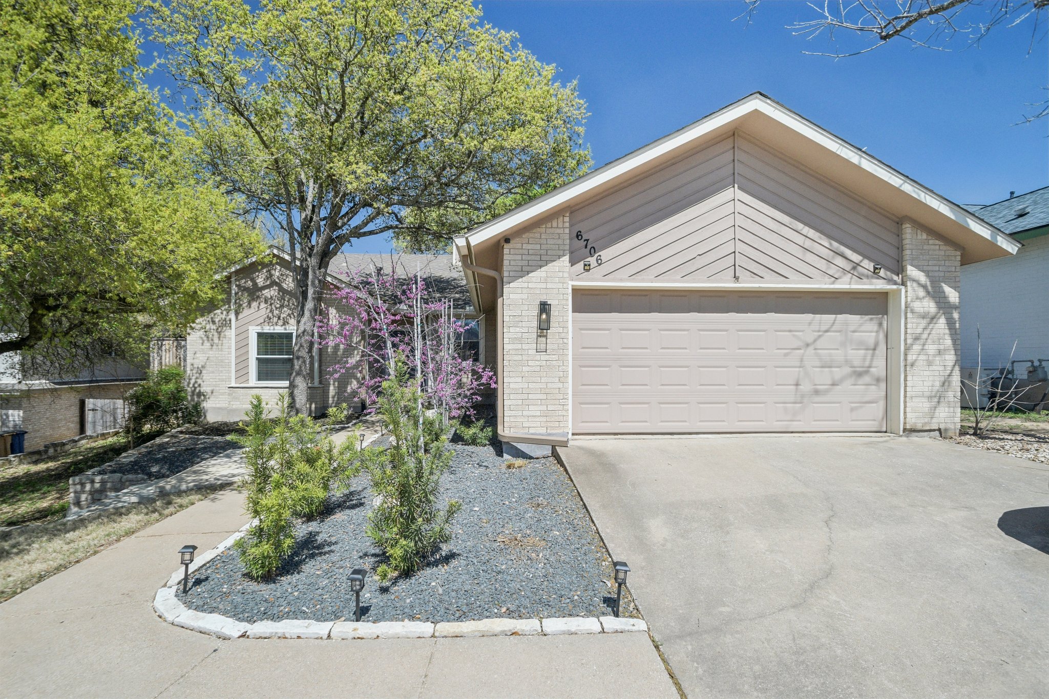 6706 Breezy Pass Austin, TX 78749 - Photo 1 of 1 a front view of a house with a yard and garage