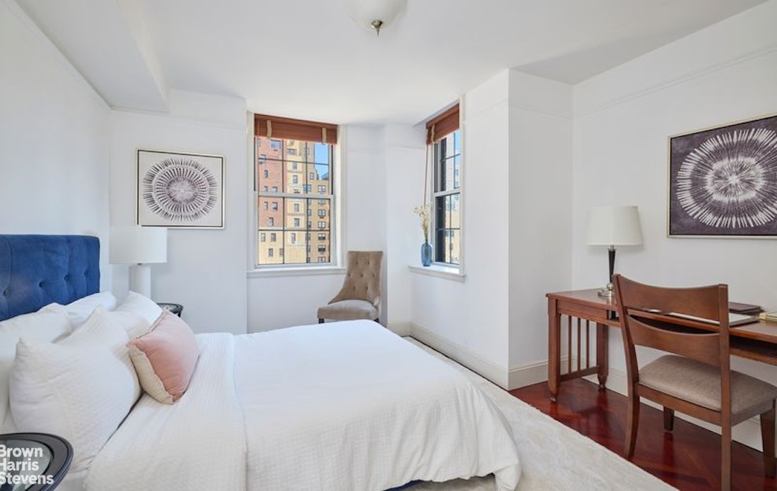 841 Madison Avenue, Unit 11/12 Manhattan, NY 10021 - Photo 15 of 19 a bedroom with a bed and a chair