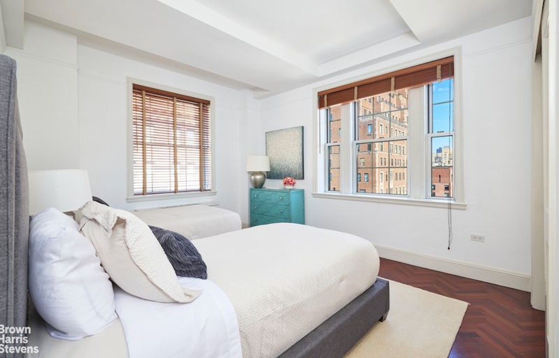 841 Madison Avenue, Unit 11/12 Manhattan, NY 10021 - Photo 17 of 19 a bedroom with a large bed and a window