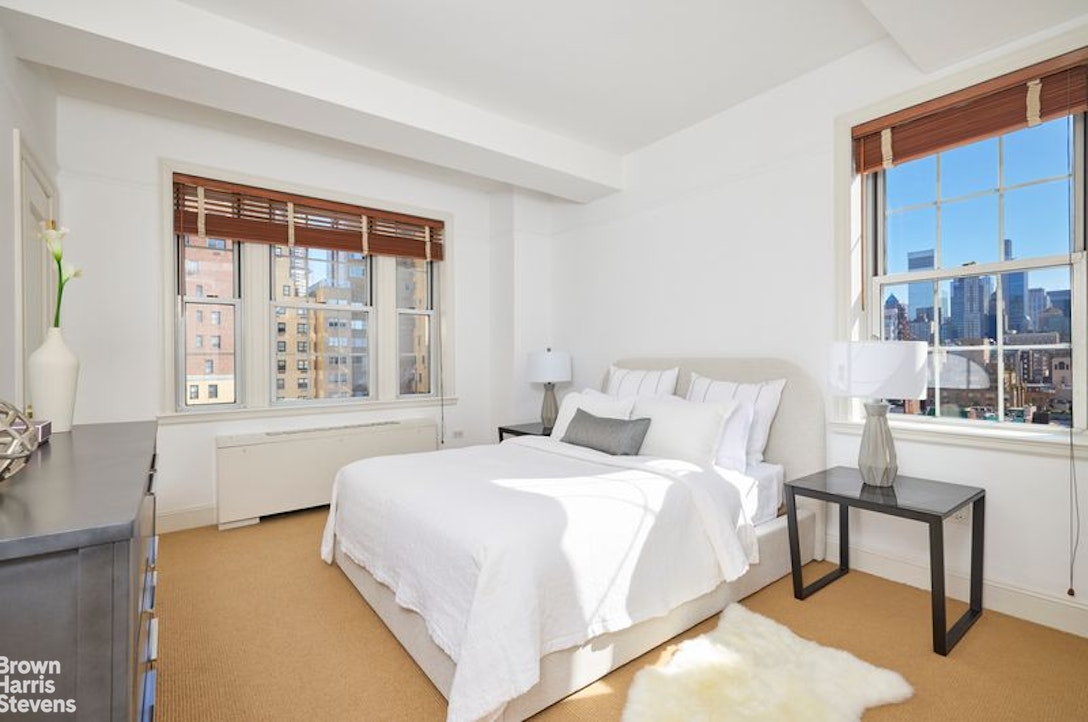 841 Madison Avenue, Unit 11/12 Manhattan, NY 10021 - Photo 18 of 19 a bedroom with a bed and a window