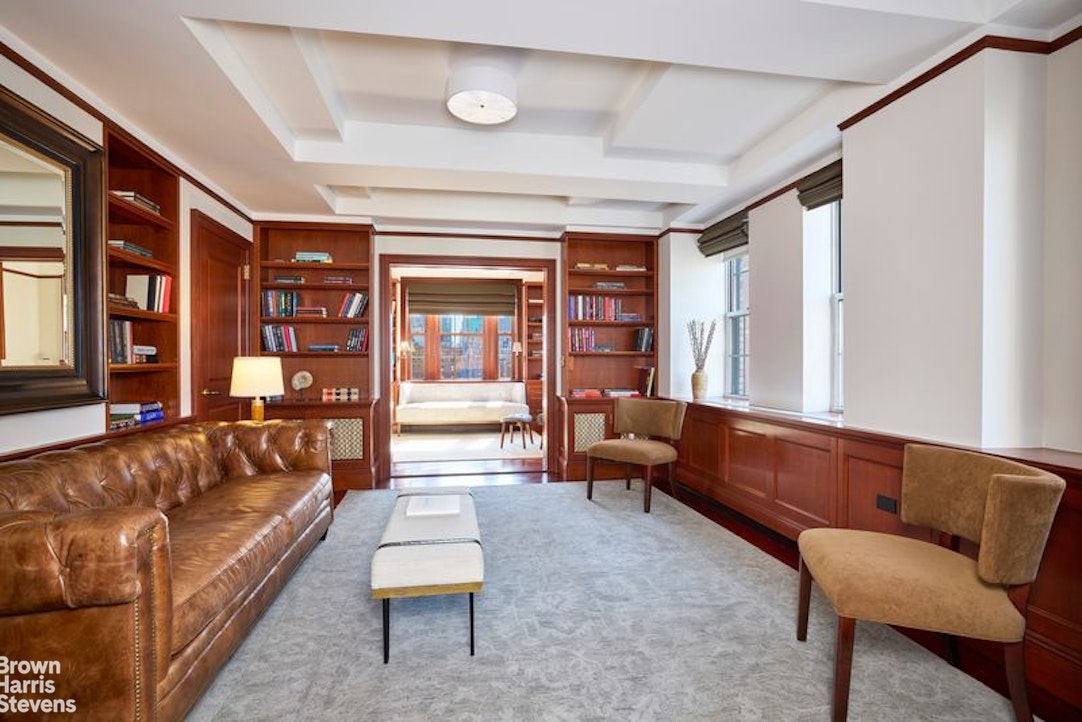 841 Madison Avenue, Unit 11/12 Manhattan, NY 10021 - Photo 5 of 19 a living room with furniture and a large window