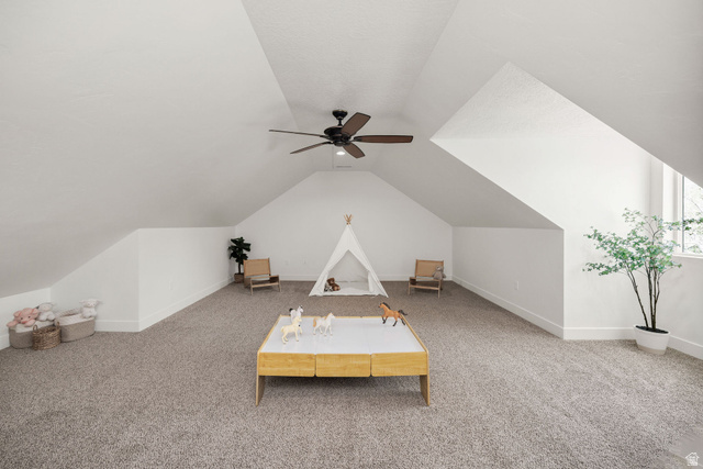 1552 Sumac Drive Logan, UT 84321 - Photo 30 of 72 Spacious bonus room featuring vaulted ceilings, plush carpeting, a ceiling fan, and abundant natural light from the window