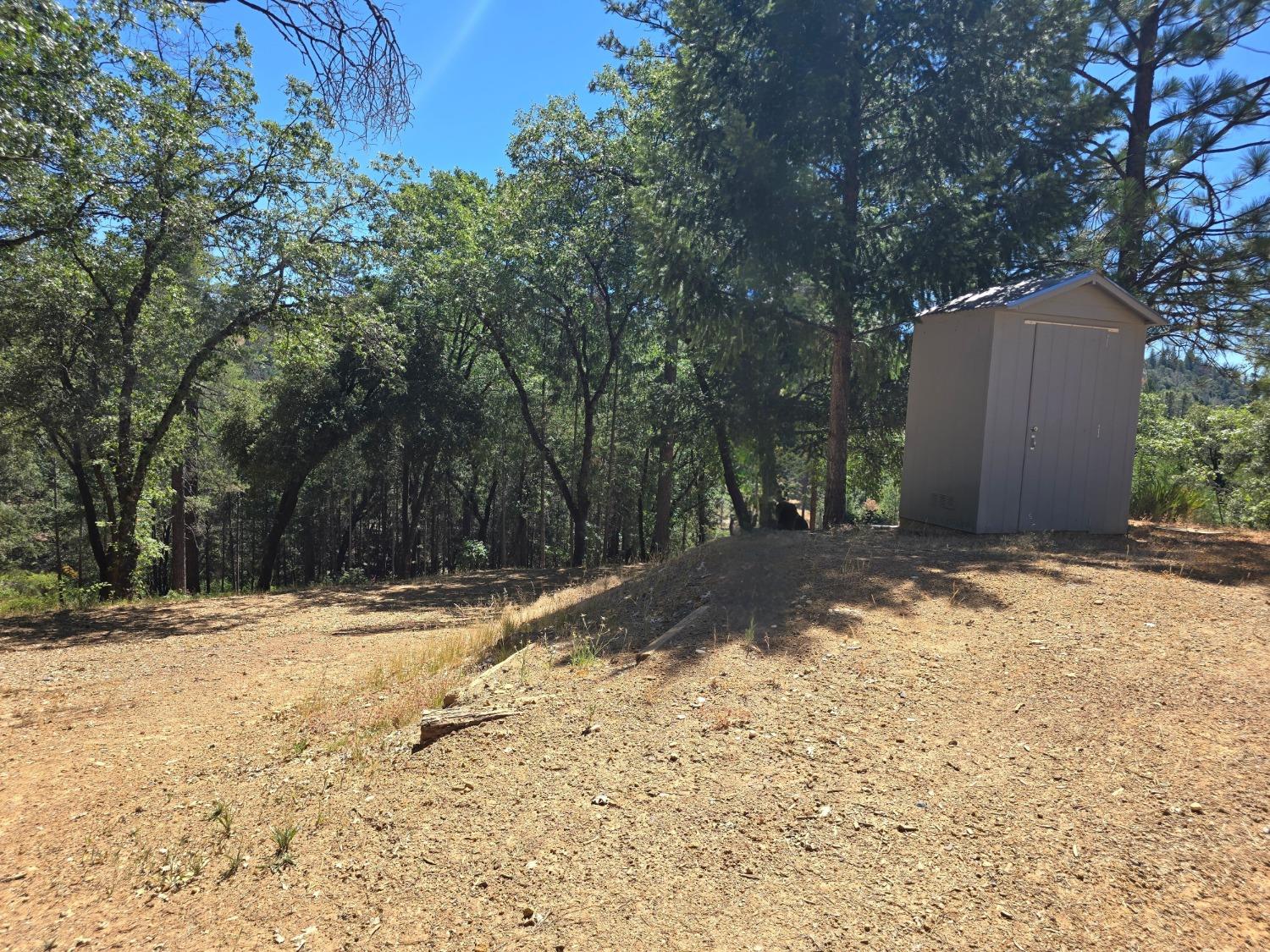 25840 Rollins Lake Road Colfax, CA 95713 - Photo 21 of 21 a view of a backyard of the house