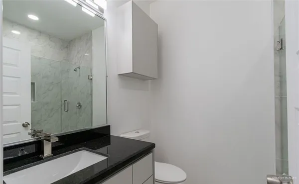 a bathroom with a sink and a toilet