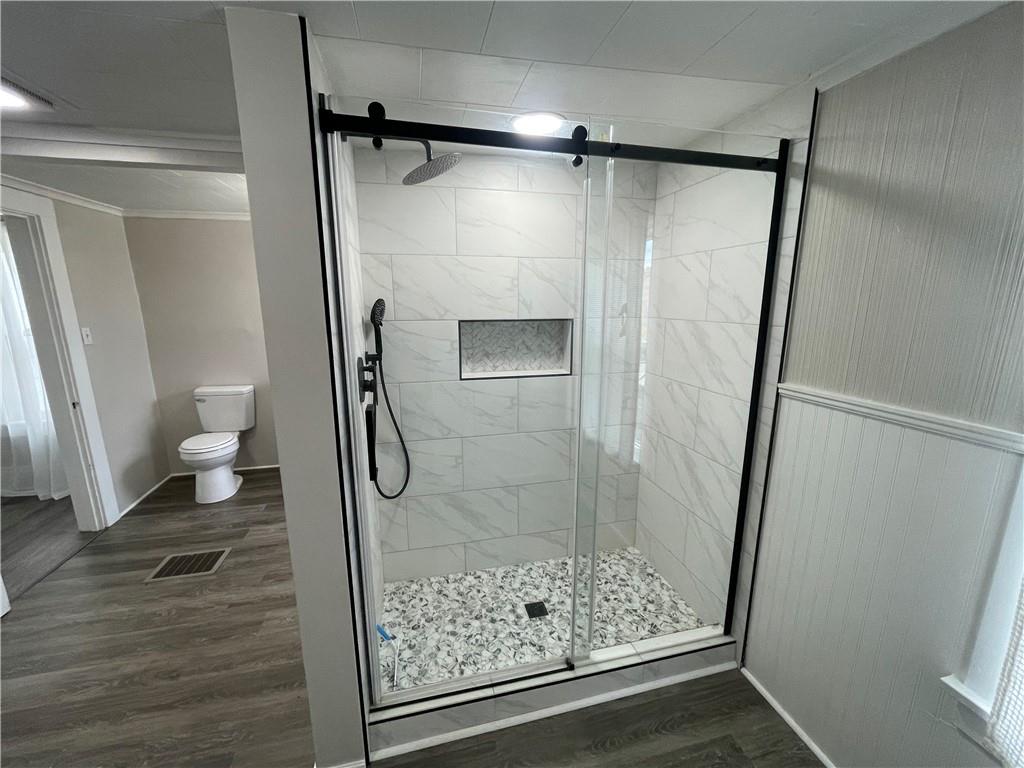 624 4th Street Monongahela, PA 15063 - Photo 23 of 29 a bathroom with a glass door shower and toilet