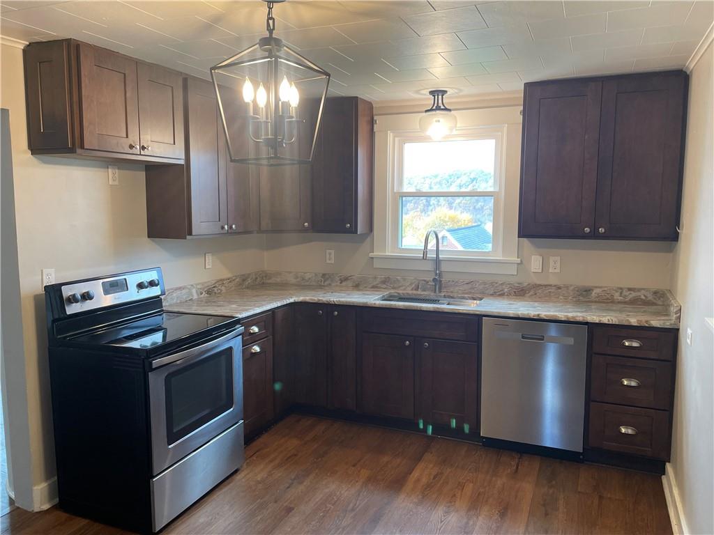624 4th Street Monongahela, PA 15063 - Photo 9 of 29 a kitchen with granite countertop wooden cabinets stainless steel appliances and a window
