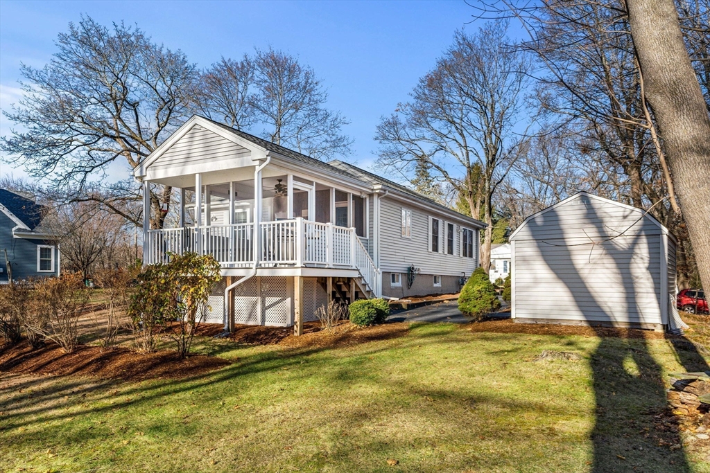 28 Van Norden Road Woburn, MA 01801 - Photo 4 of 24 a view of a house with a yard and sitting area