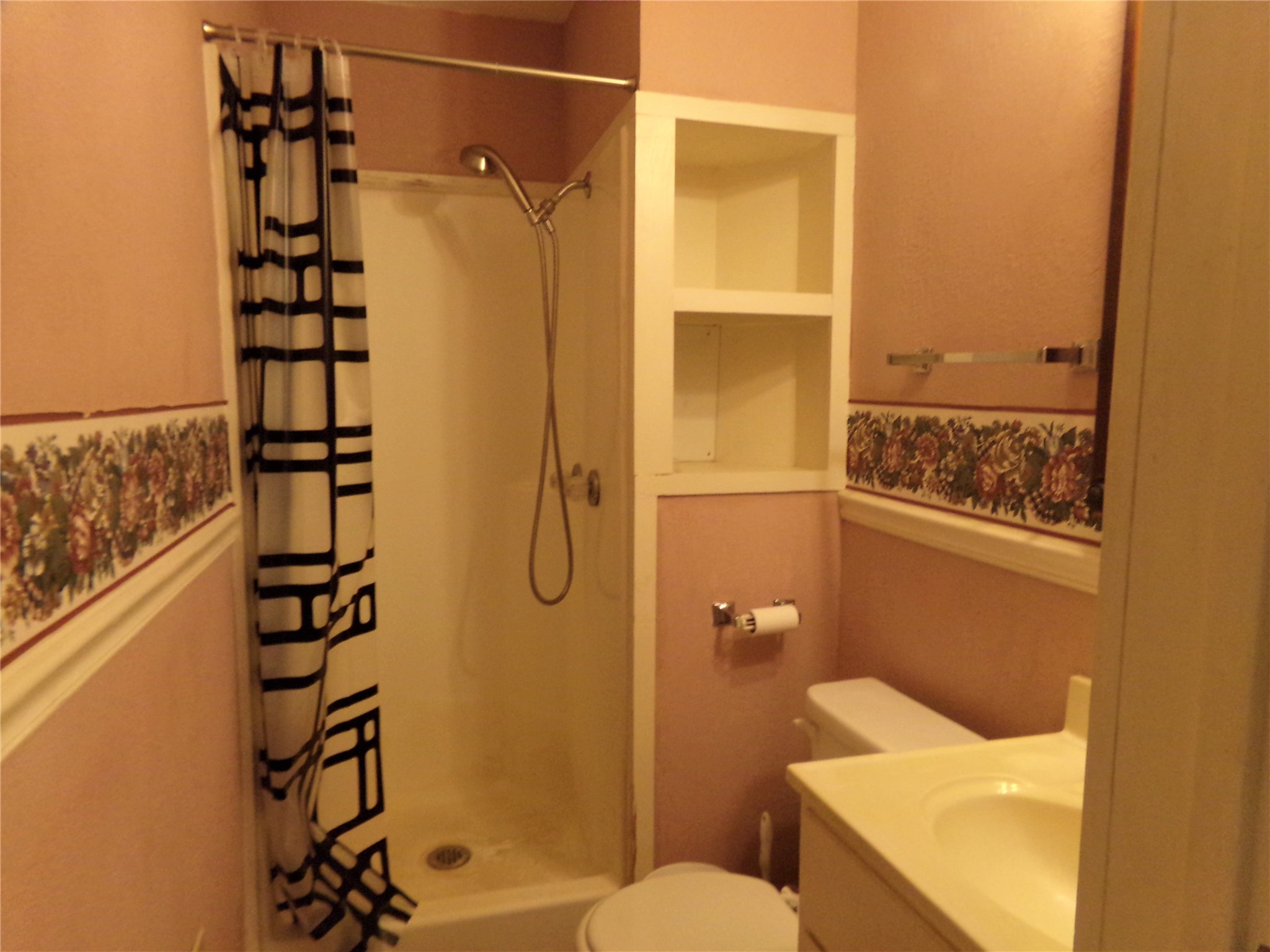 300 South Summit Street Weimar, TX 78962 - Photo 21 of 27 a bathroom with a shower toilet and sink