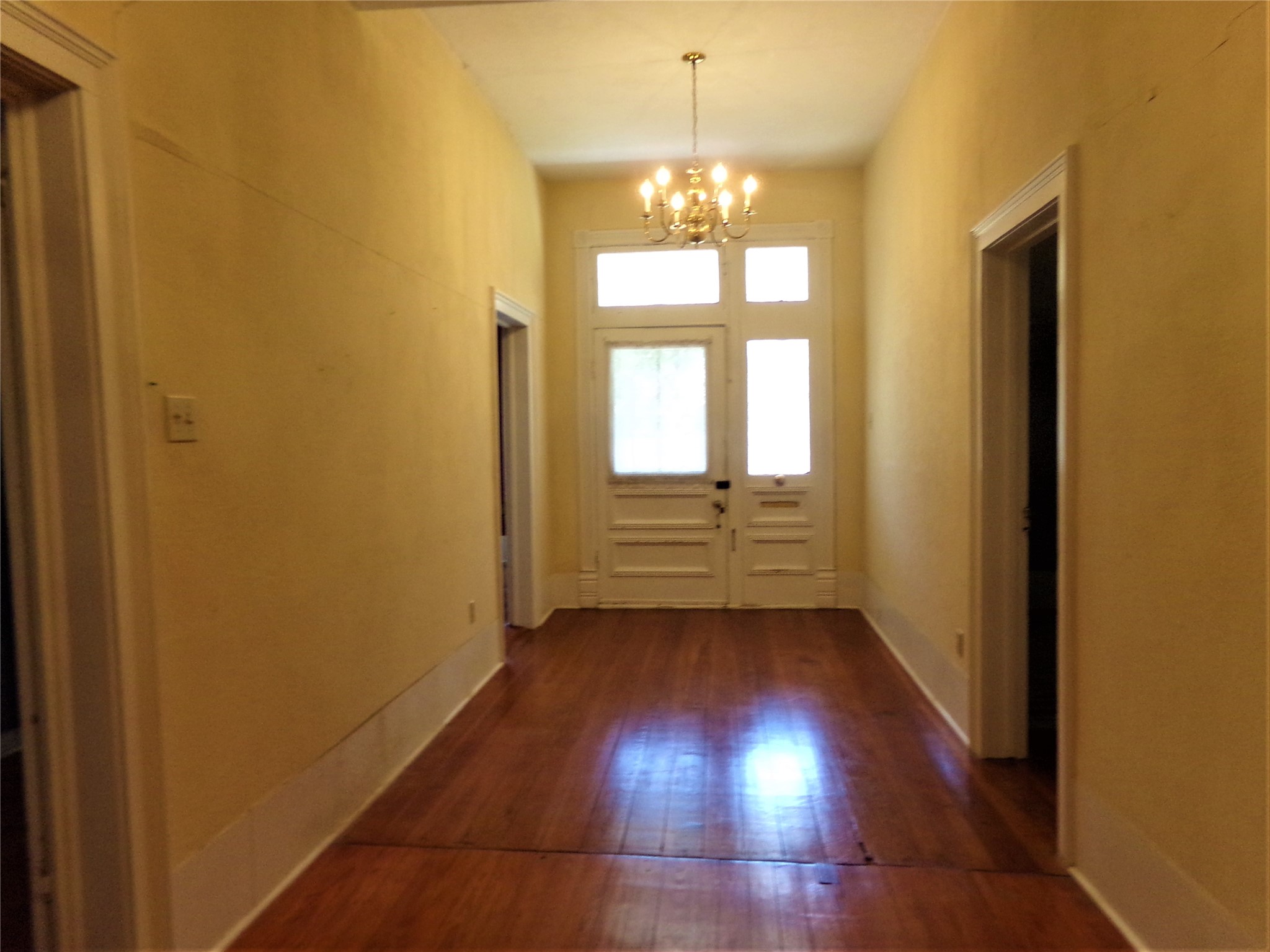 300 South Summit Street Weimar, TX 78962 - Photo 8 of 27 a room with window and wooden floor